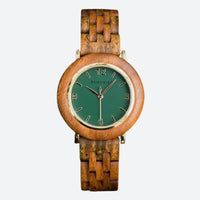 Women's wooden watch with a clean dial and natural green colors on a grey background
