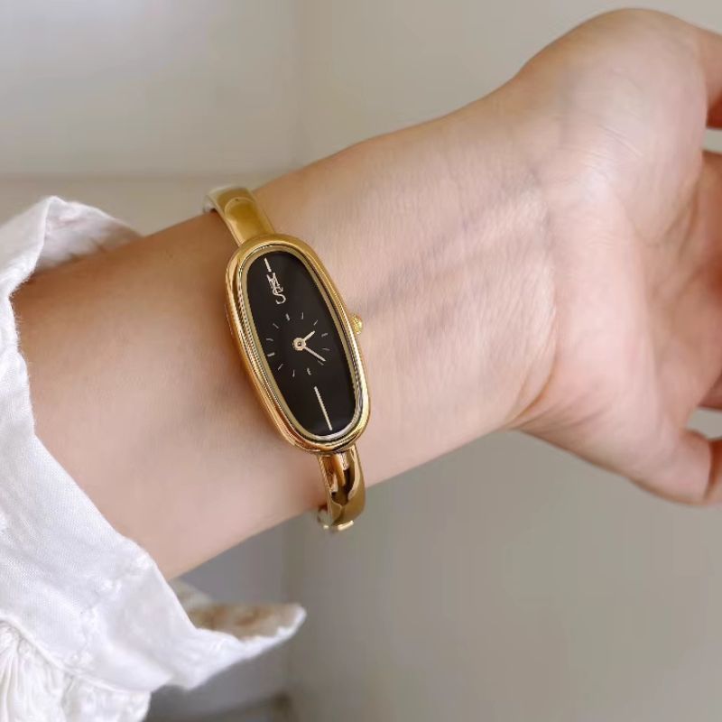 Women's Gold Bangle Watch with Oval Black Dial, Water Resistant