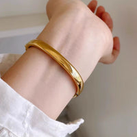Women's Gold Bangle Watch with Oval Black Dial, Water Resistant