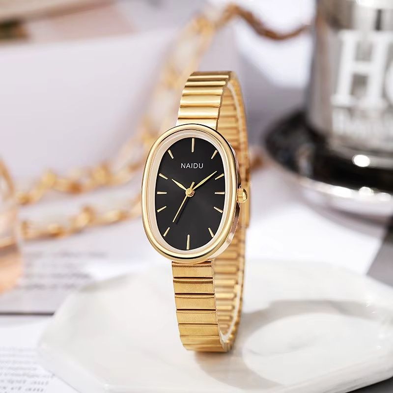 Women's Oval Gold Quartz Watch with Wide Minimalist Bracelet
