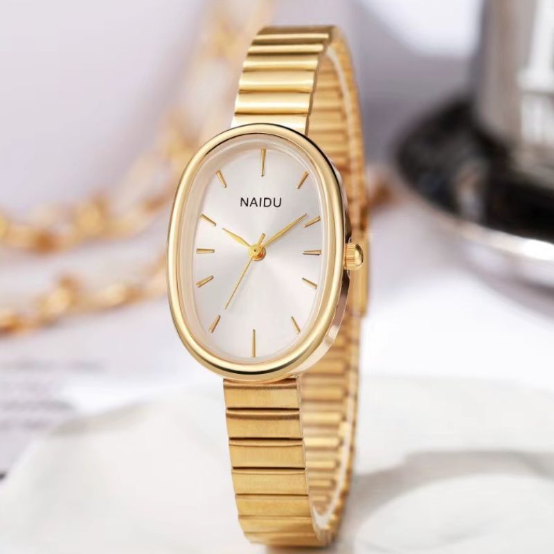 Women's Oval Gold Quartz Watch with Wide Minimalist Bracelet