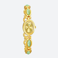 Vintage Oval Women's Watch, gold case with gold dial, bracelet decorated with gold and green oval links, elegant and timeless style.