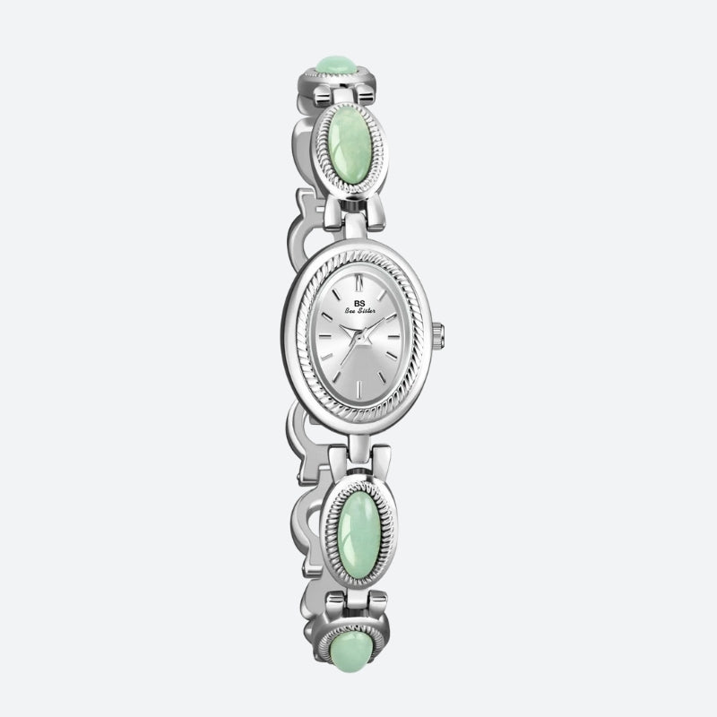 Vintage Oval Women's Watch, silver case with silver dial, bracelet adorned with silver and green oval links, elegant and refined design