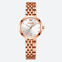 Luxury vintage women's watch in rose gold, with an elegant silver dial and a polished steel bracelet.