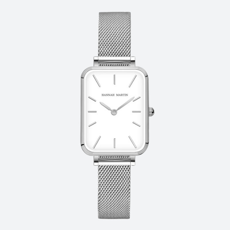 Vintage women's watch with a rectangular silver shape, fine mesh, minimalist white dial and glossy finish.