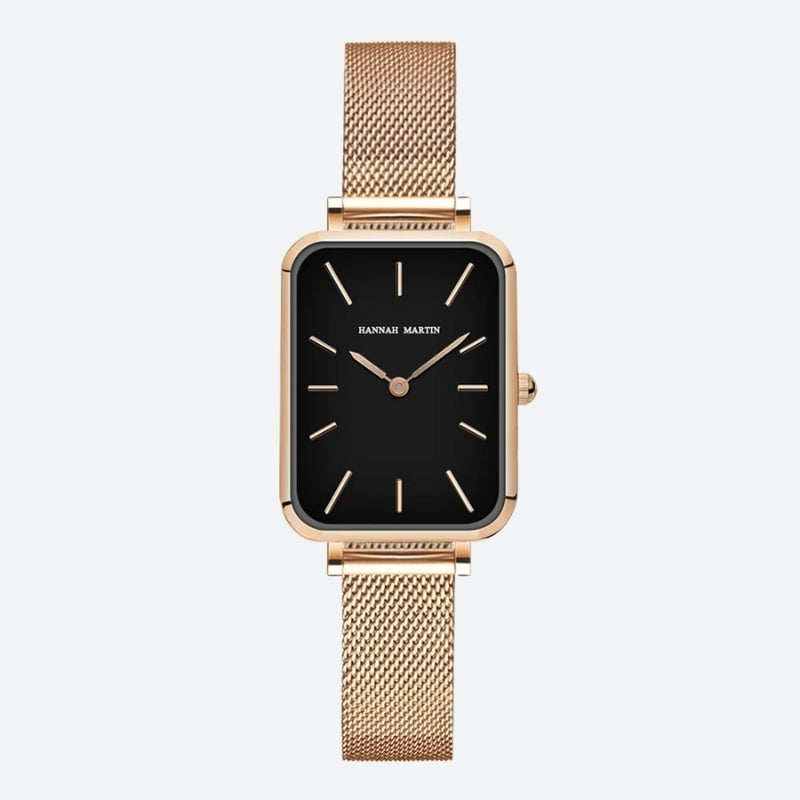 Vintage women's watch with a rectangular gold shape and fine mesh, deep black dial contrasted by a polished gold case. Image
