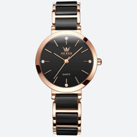 Vintage women's watch with a round shape in rose gold and black, elegant black dial with gold markers and black ceramic bracelet.