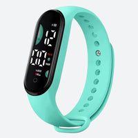 Women's Digital Watch with Minimalist Design and Vibrant Mint Green Color on a Grey Background